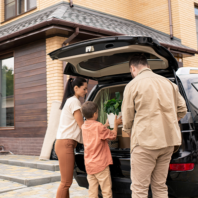 A family by their car